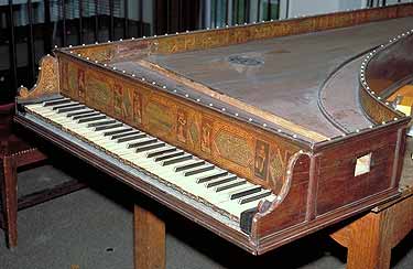 A view of the 1579 Baffo (Muse de la Musique, Paris) harpsichord showing its decorated nameboard and mahogany casework