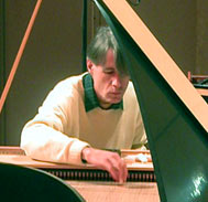 Photo of Denzil Wraight: caught unawares while tuning the Ferrini fortepiano for the first concert in the Muse de la Musique, Paris (photo courtesy of Martin Gester)